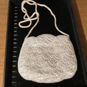 Magid cream beaded clutch with matching satin cord shoulder strap